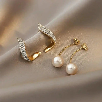 Boucles d'oreilles en or ornées d'une élégante goutte de perle