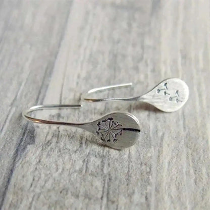 Boucles d'oreilles vintage en argent, délicatement sculptées en forme de fleur