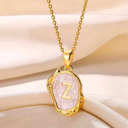 Collier océan plaqué or 18 carats avec initiales au fond de la mer