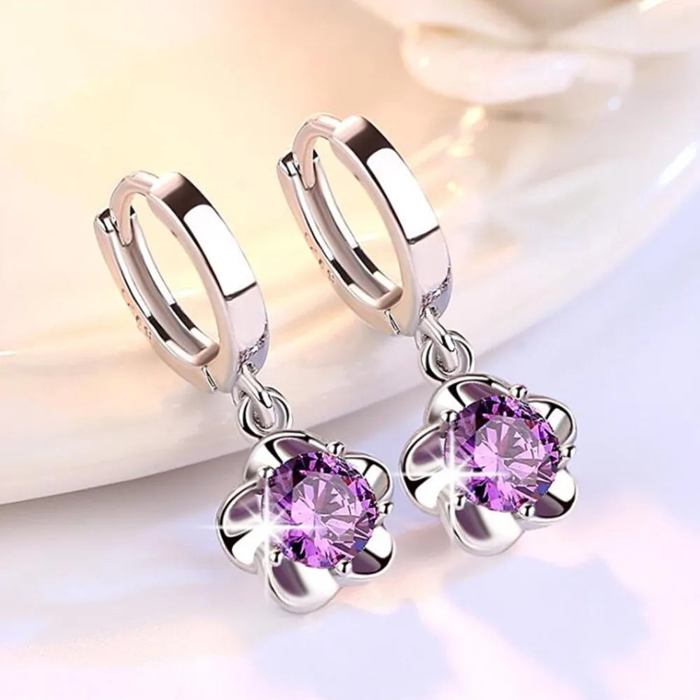 Boucles d'oreilles en argent avec des zircons violets et blancs