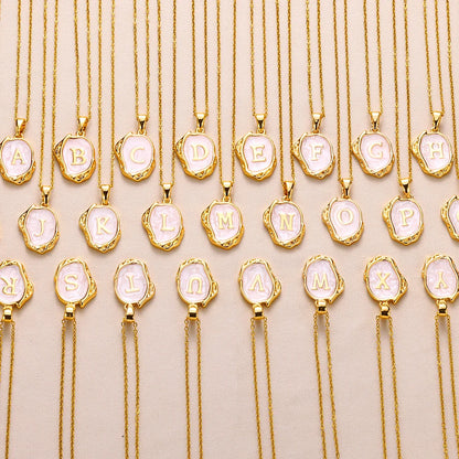 Collier océan plaqué or 18 carats avec initiales au fond de la mer